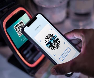 using a smartphone, they scan the QR code from the payment terminal